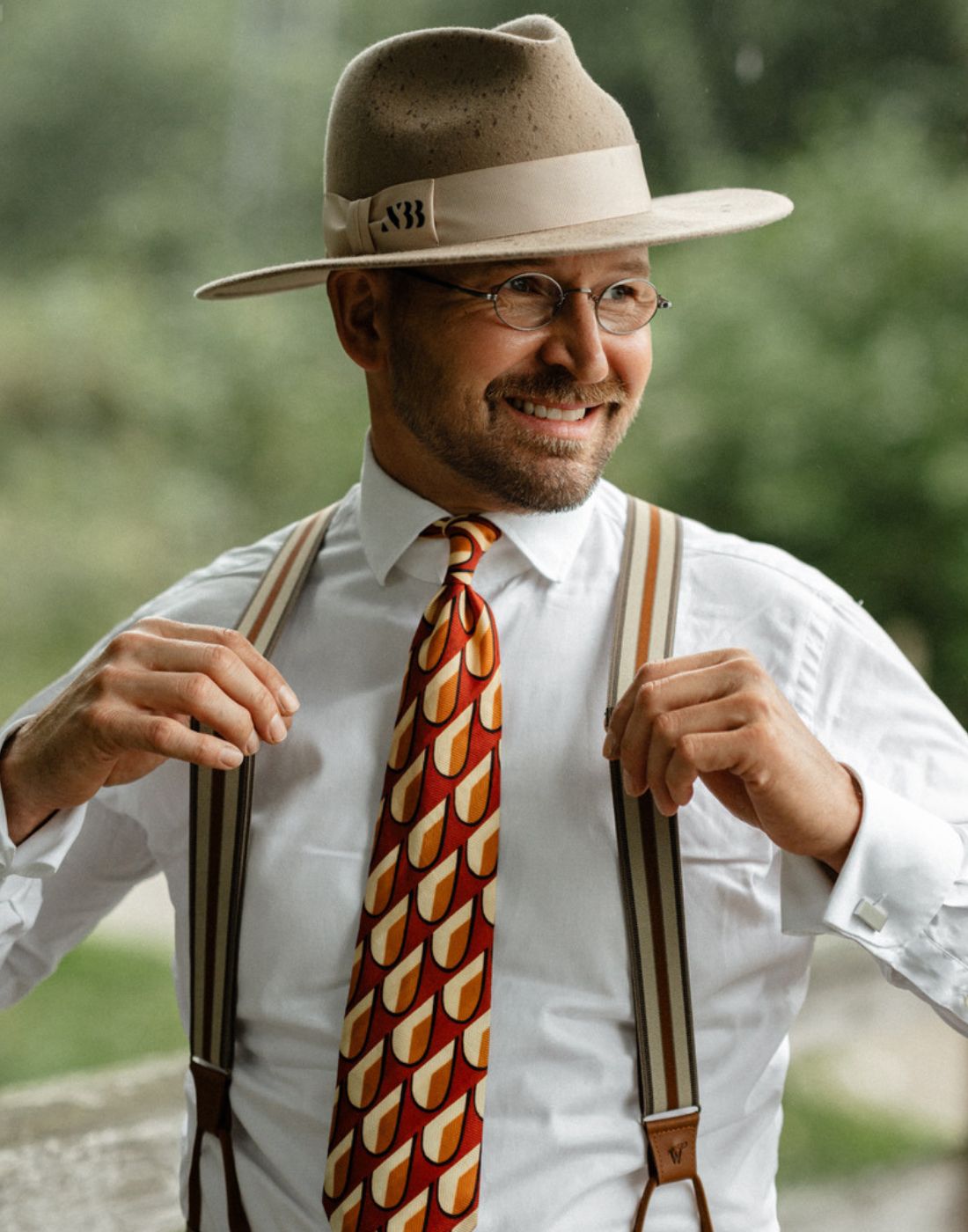 Man wearing tie, Elastic Wiseguy Original Suspenders and a classic hat