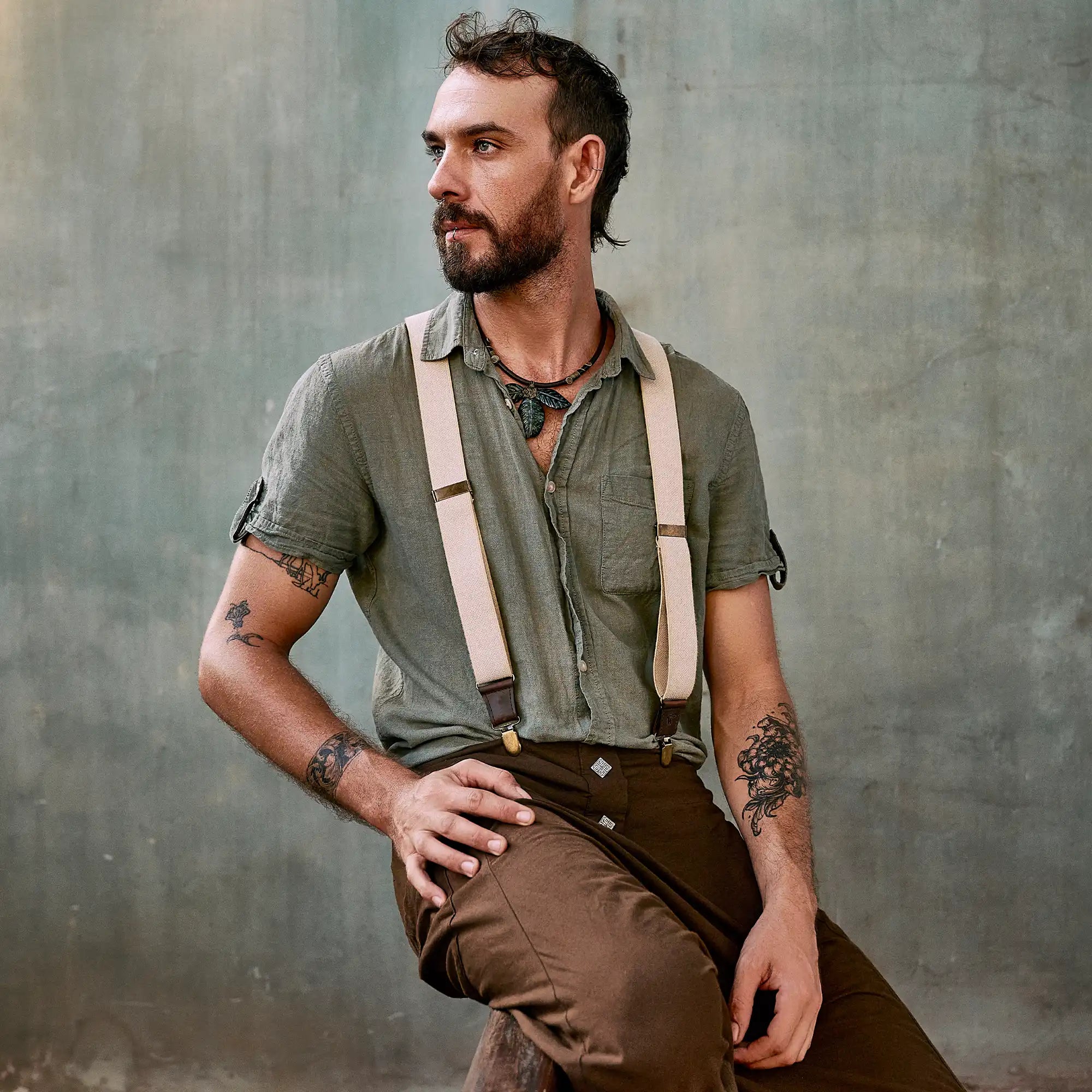 Bearded man with button shirt and Wiseguy Original Suspenders posing for photo
