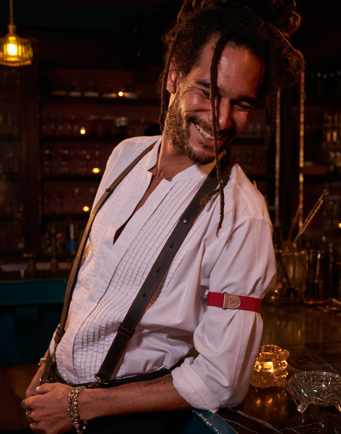 Man smiling, wearing white shirt, black suspenders and Wiseguy Original Sleeve Garters